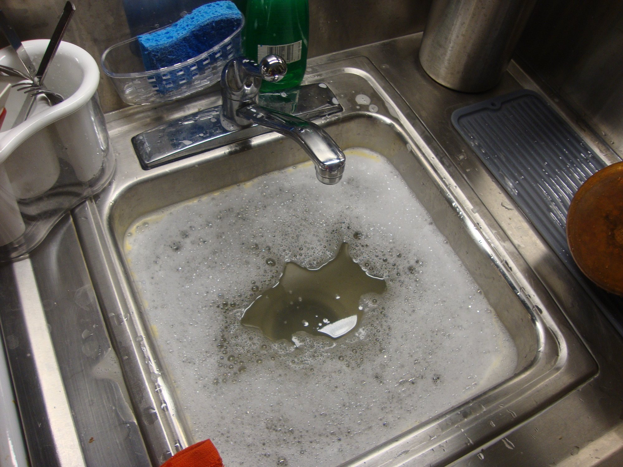 https://www.myhomebeaver.com/wp-content/uploads/2019/07/Clogged-Kitchen-Sink.jpg